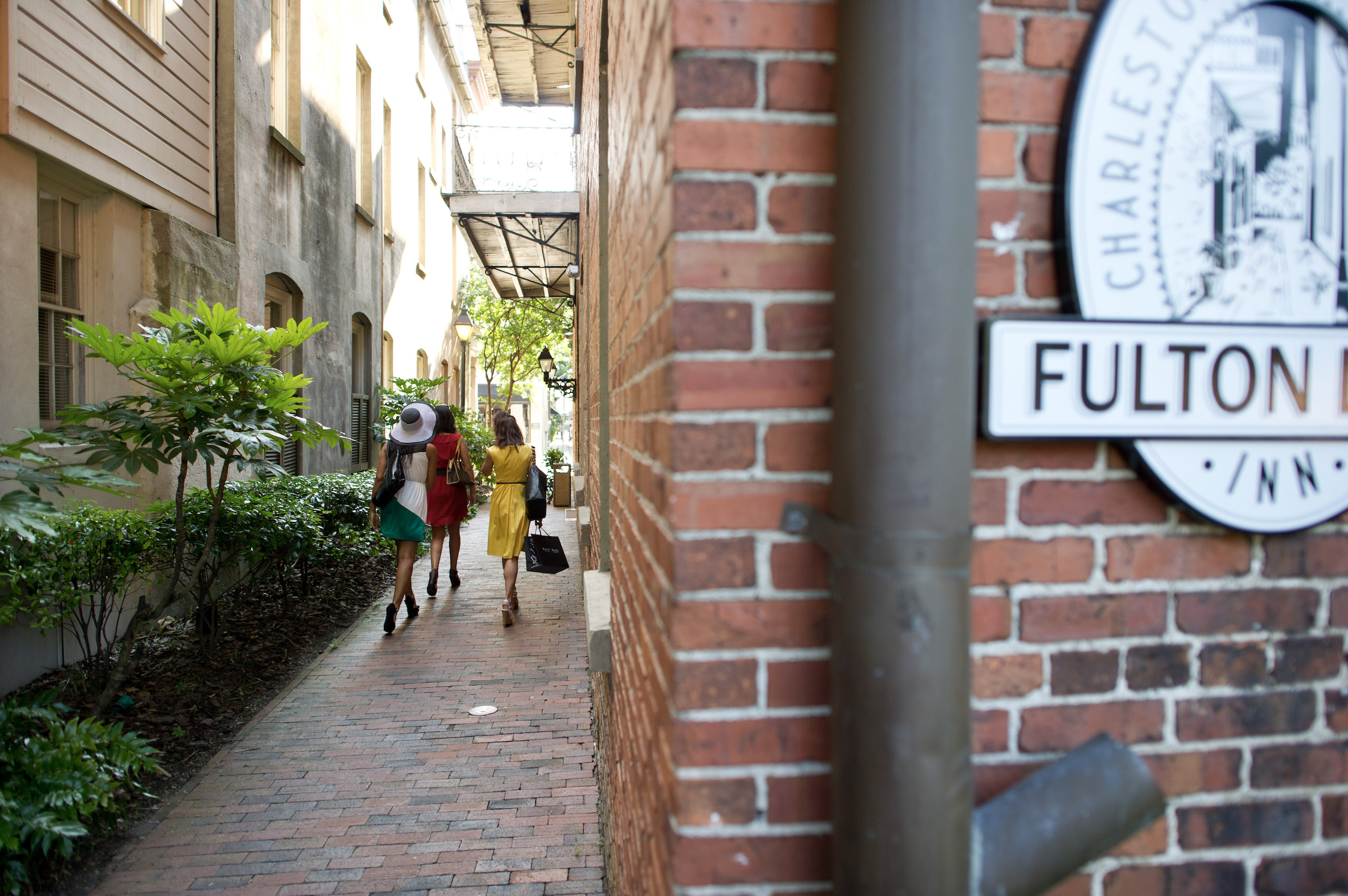 Women walking down the entrance to Fulton Lane Inn walkway