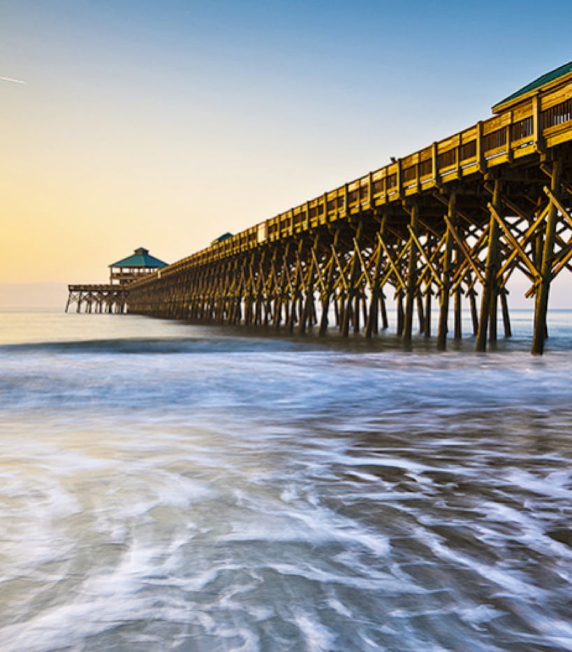 a long pier at sunset